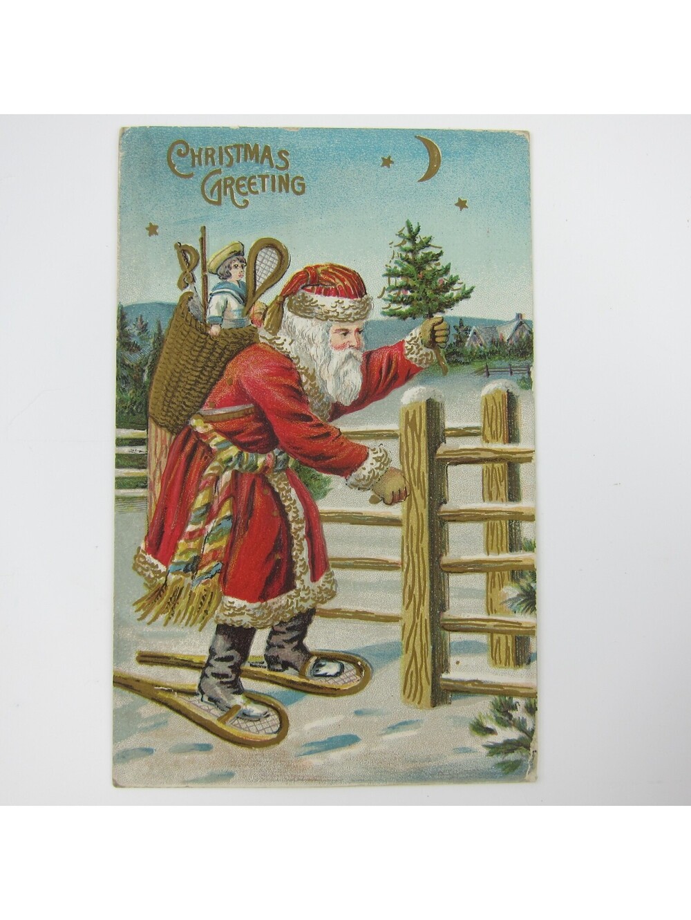 Vintage Christmas Postcard Old World Santa Fence Snow Shoes Toys Basket Antique